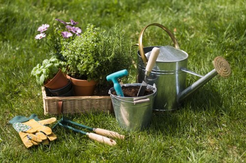 Gardener working in a Ruislip garden, wide view of accessible pathway